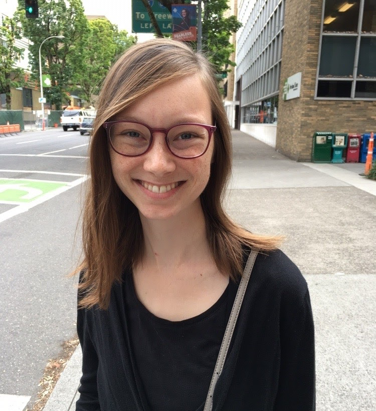 A photograph of blog author Laura Proescholdt in an outdoor city setting.