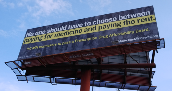 Billboard that says "No one should have to choose between paying for medicine and paying the rent. Tell MN lawmakers to pass a Prescription Drug Affordability Board."
