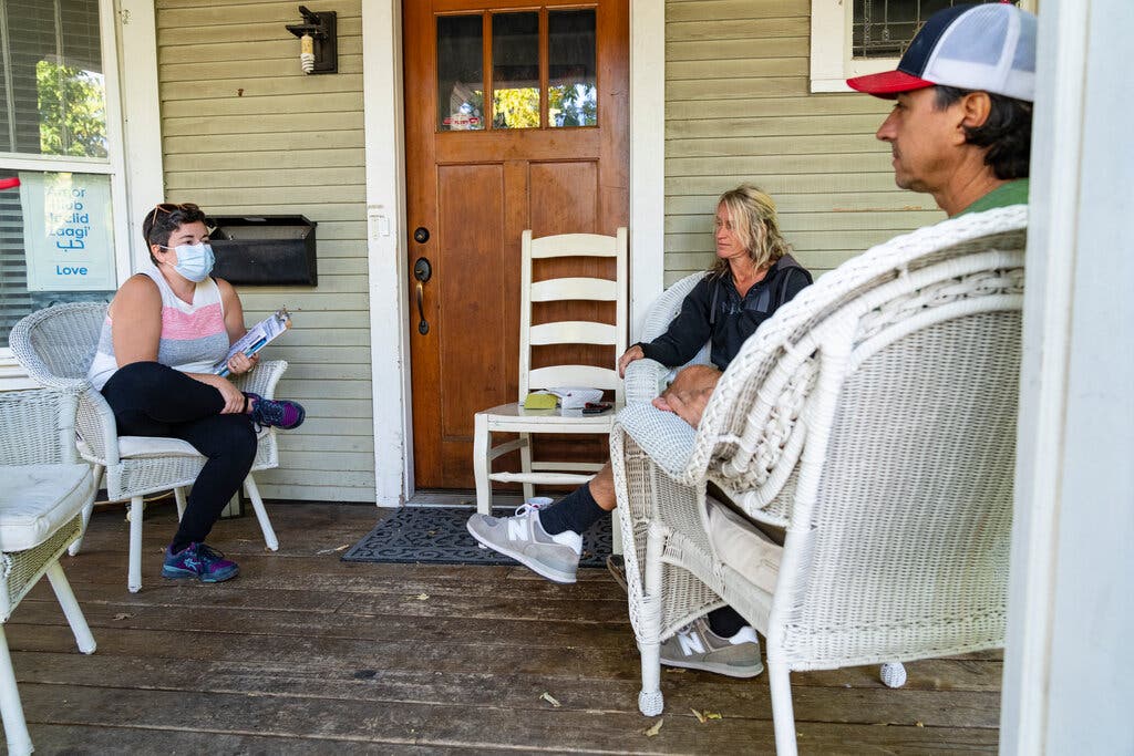 A canvasser, Amanda Otero, left, spoke with Mary Scavotto about a Minneapolis ballot measure.