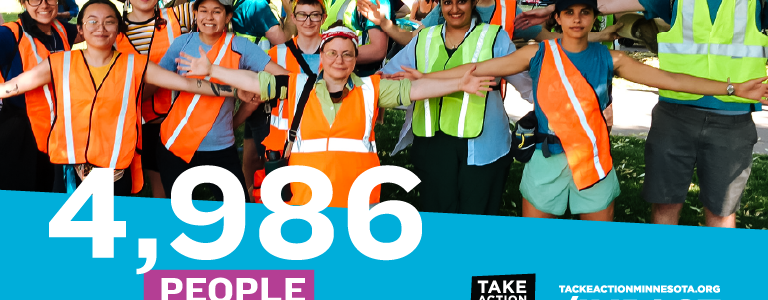 A photo of TakeAction members wearing orange safety vests at a direct action in 2021. A blue block at the bottom of the image features the TakeAction Minnesota logo and text that says "4,986 people activated... TakeActionMinnesota.org/IMPACT."