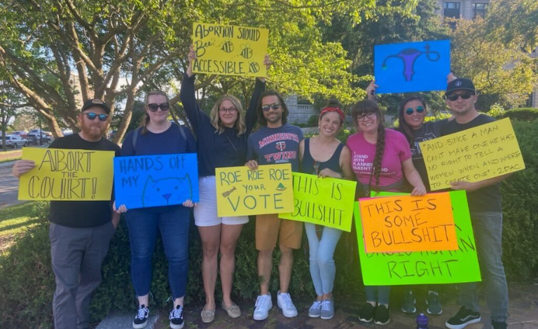 protestors for reproductive freedom hold signs